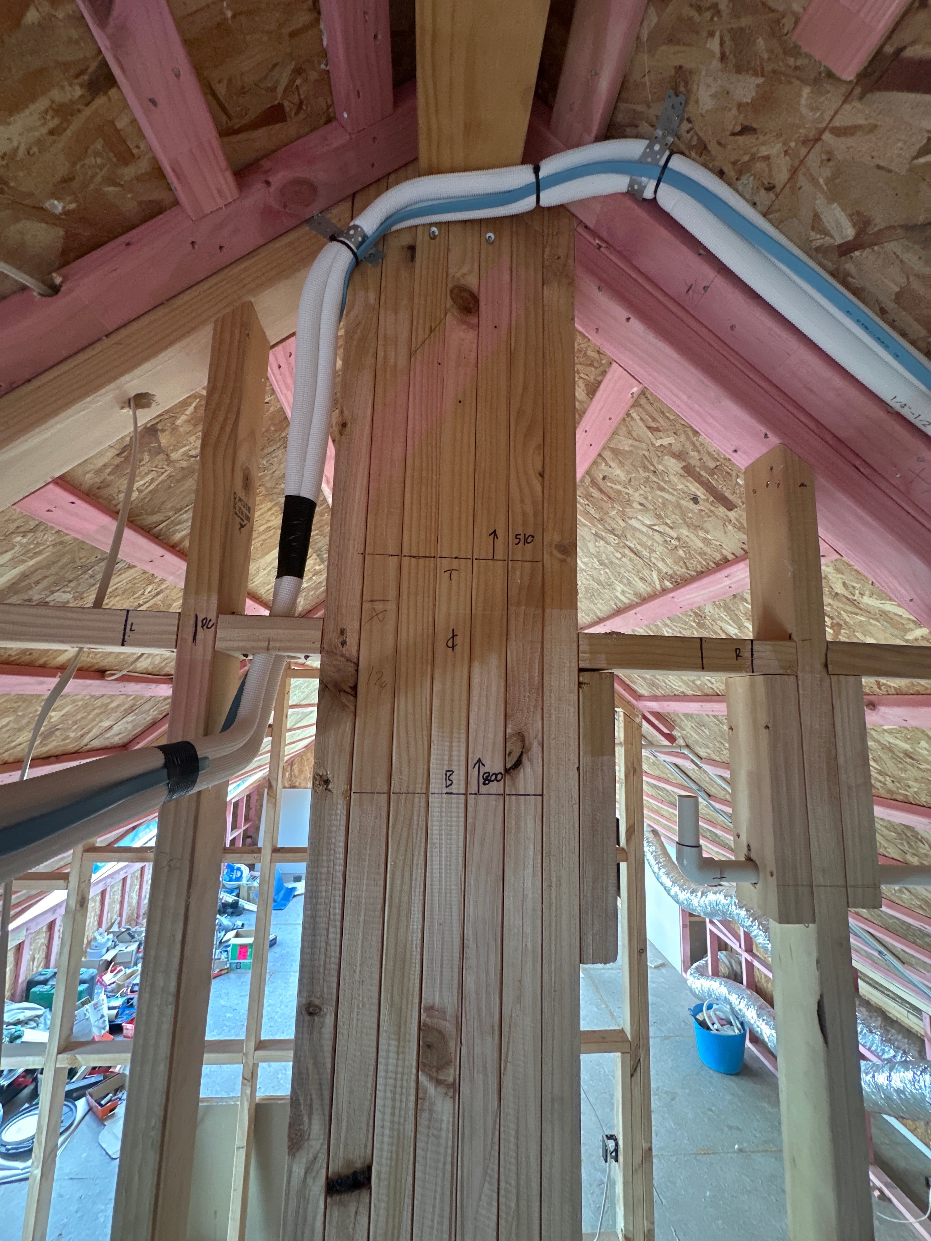 Insulated refrigerant pipework for a Panasonic multi-split heat pump system installed within the timber framing of a new home in Cambridge, Waikato.